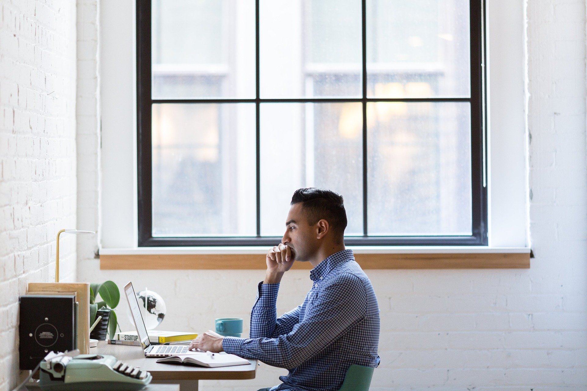 Student researching at his desk 