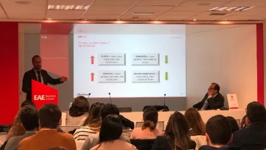 Luis Suárez and Alberto Bendayán from Liberbank giving a talk at EAE