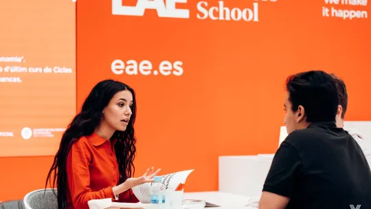 People talking at an event at EAE Business School