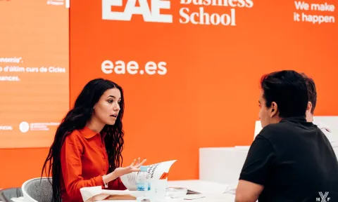 People talking at an event at EAE Business School