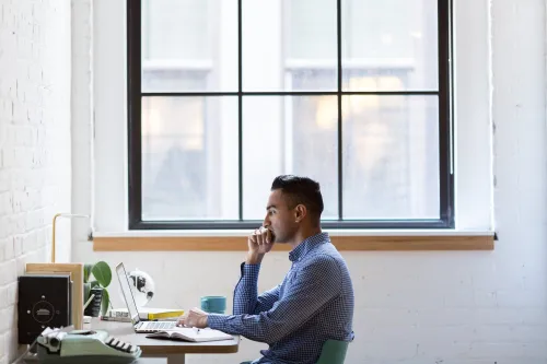 Student researching at his desk